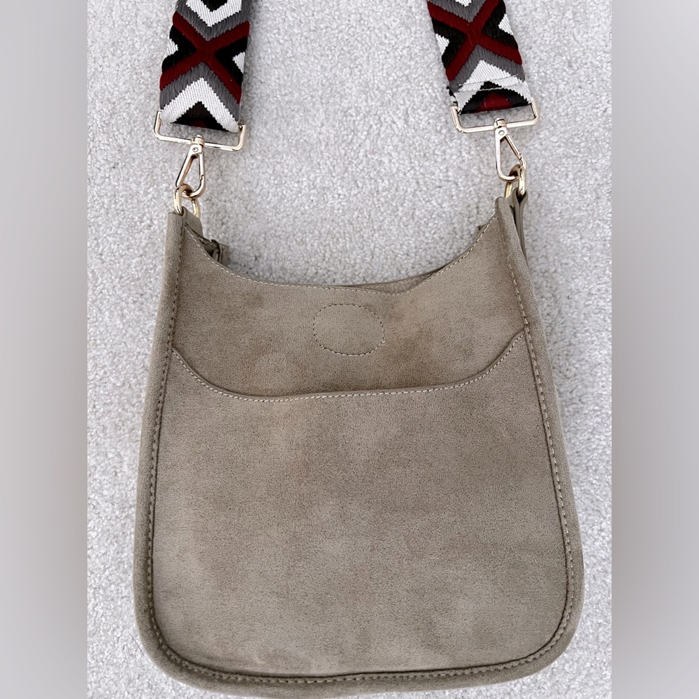 Ah-dorned suede cross body bag w/ guitar strap